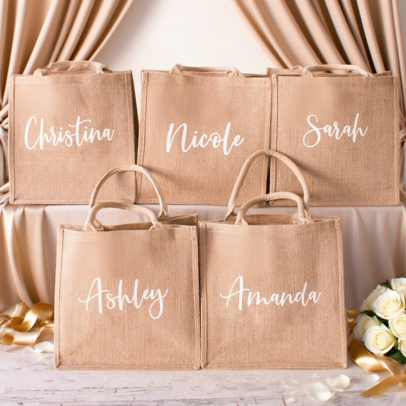 five burlap tote bags with names printed on them 