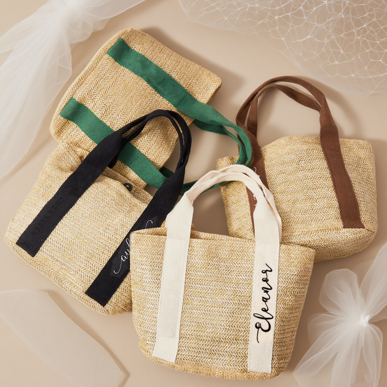 Four straw bags with colorful straps on a beige background, colorful straps embroidered with personalized name